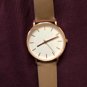 Rose gold and tan watch